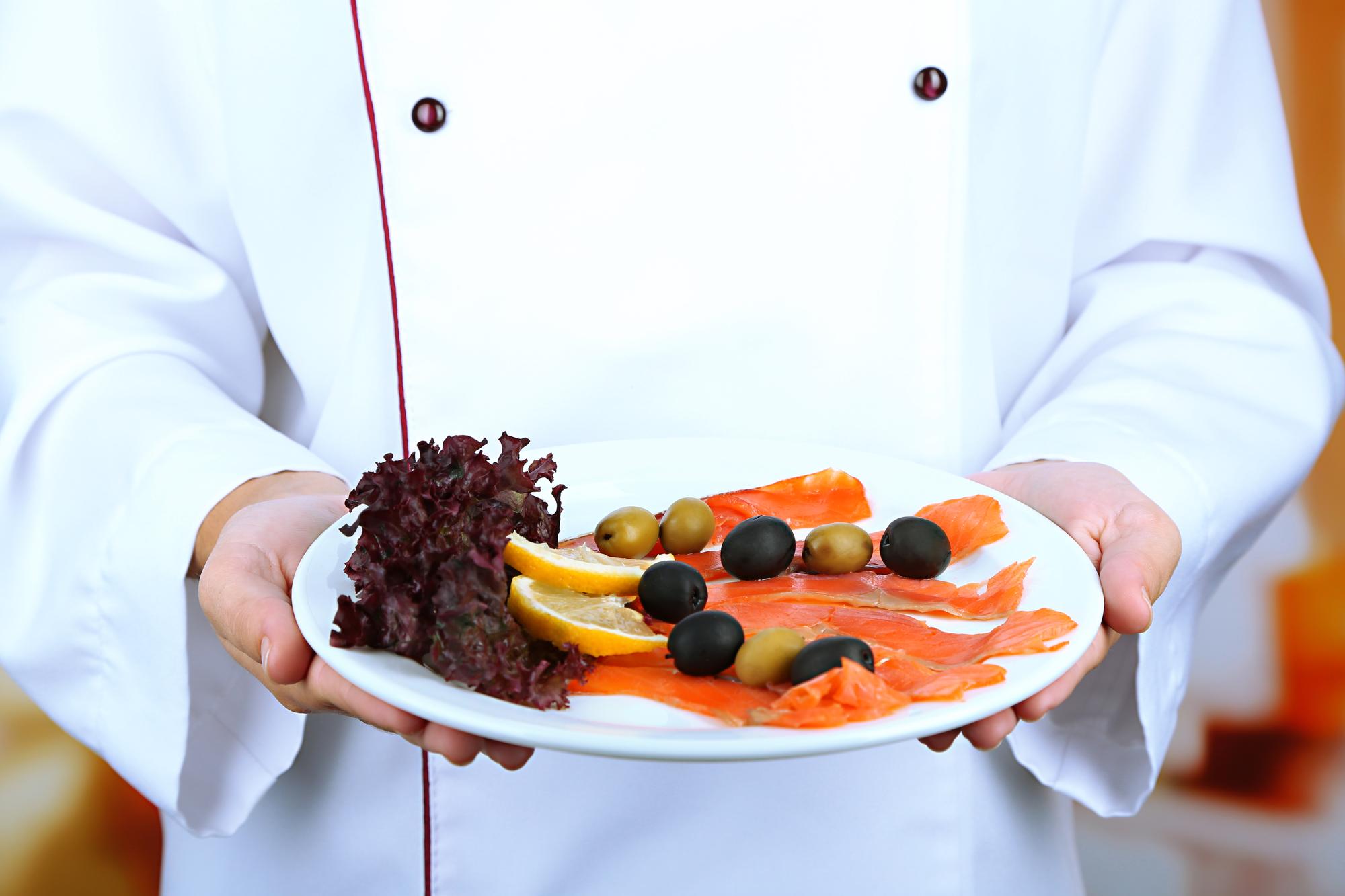 Chef arranging a multi-course plated tasting