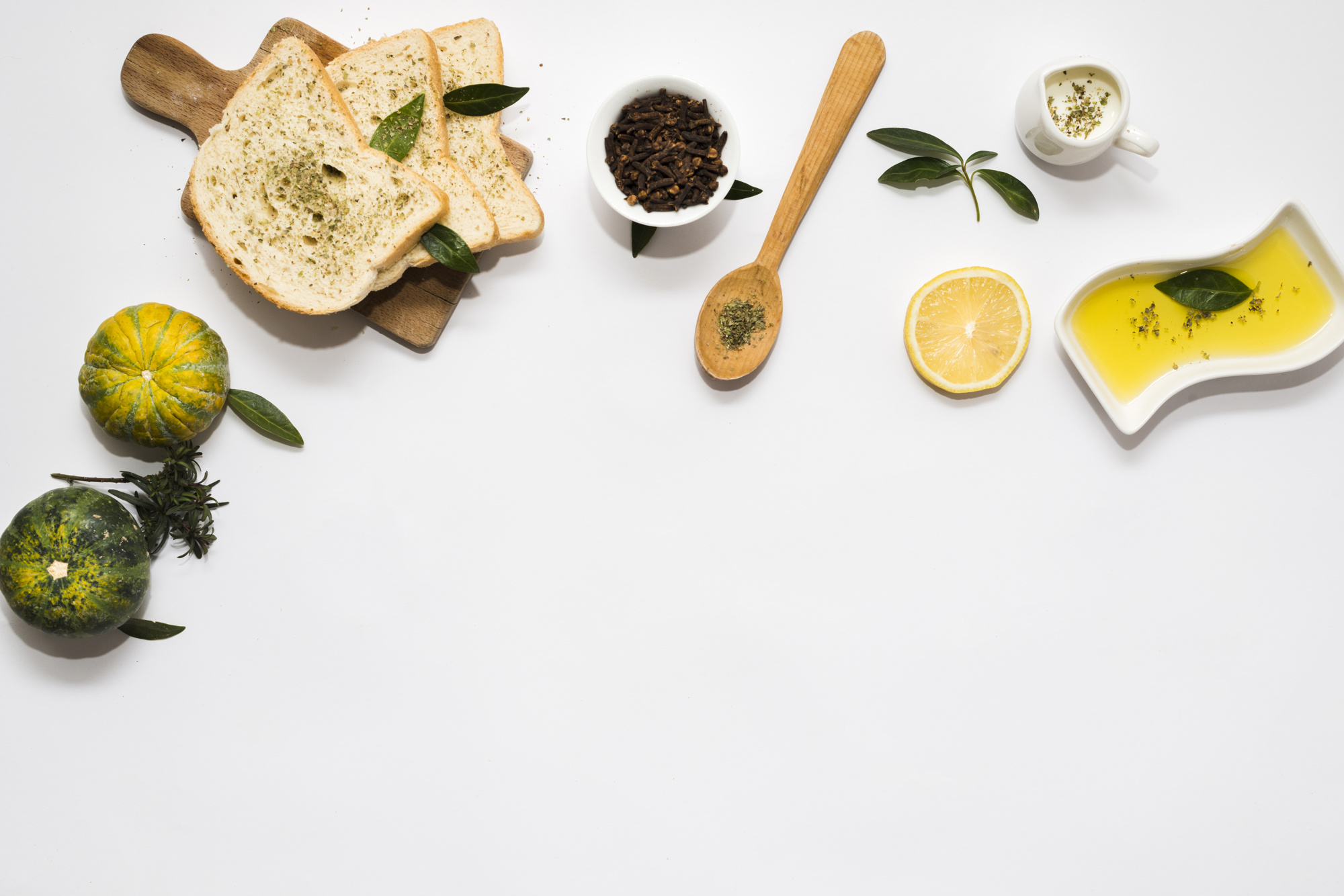 Curated ingredients on a wooden board with herbs and citrus